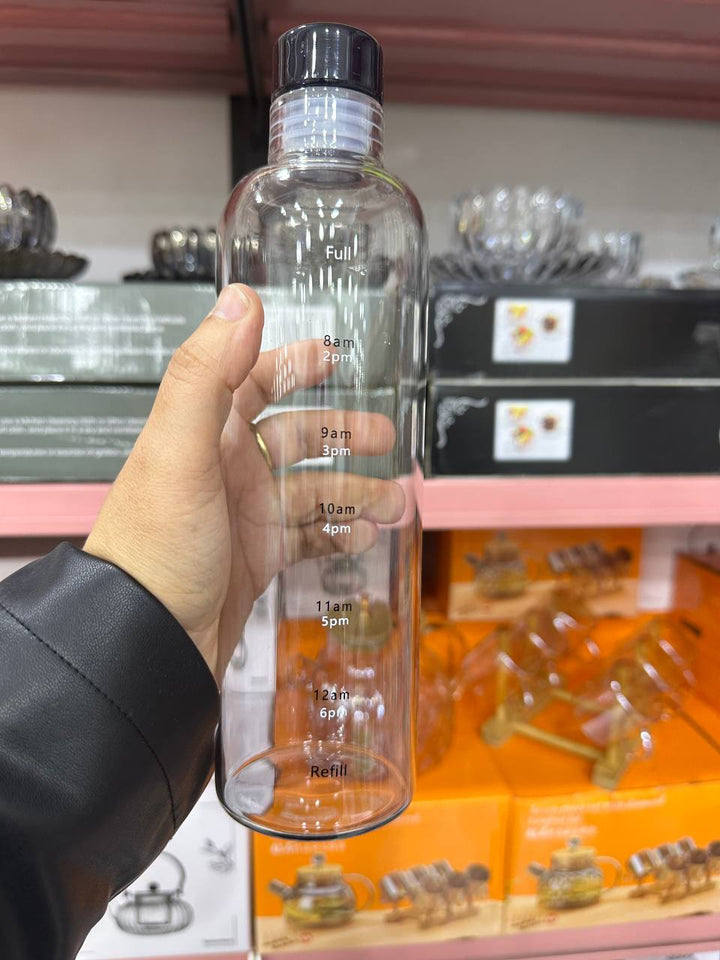 زجاجة زجاج ملوّنة – سعة 1 لتر | شكل أنيق ومناسب للتقديم أو الاستخدام اليومي 💧